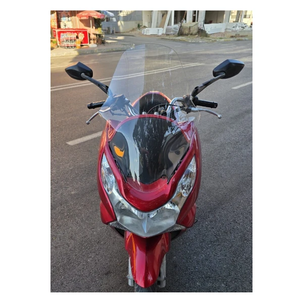 Honda Pcx Siperlik Ön Cam 2011 2013 Model 59Cm Şeffaf Renkli Orta Boylu Cam Honda Pcx Siperlik Ön Cam 2011 2013 Model 59Cm Şeffaf Renkli Orta Boylu Cam